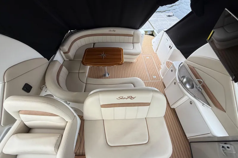 Slide: The Image of Luxurious interior of 2007 Sea Ray 40 Sundancer yacht with elegant seating and wooden table. - 15