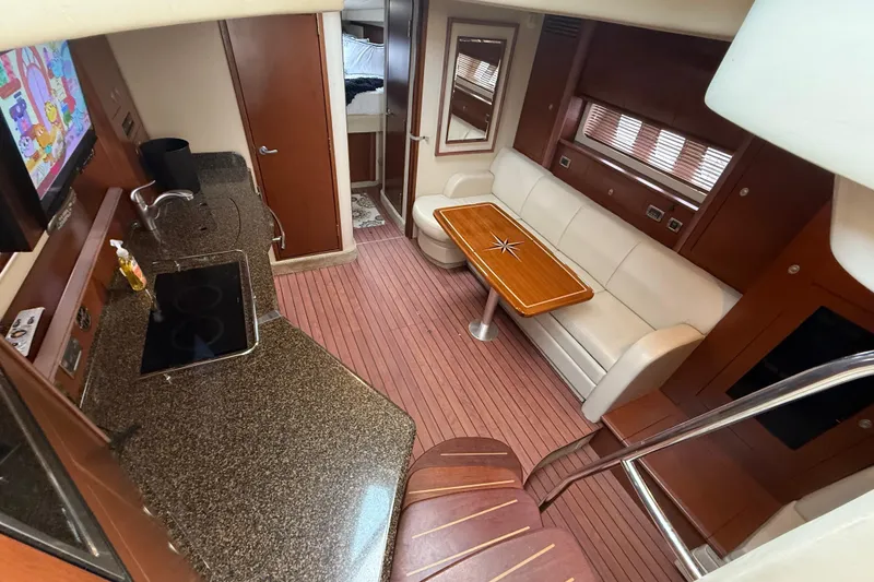 Slide: The Image of Luxurious interior of 2007 Sea Ray 40 Sundancer yacht with kitchen and seating area. - 17