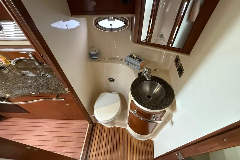 Slide: The Image of Luxurious bathroom in 2007 Sea Ray 40 Sundancer yacht with modern fixtures and wood accents. - 20