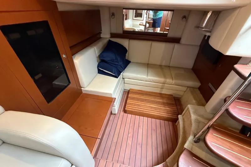 Slide: The Image of Luxurious interior of 2007 Sea Ray 40 Sundancer yacht with wooden flooring and leather seating. - 22