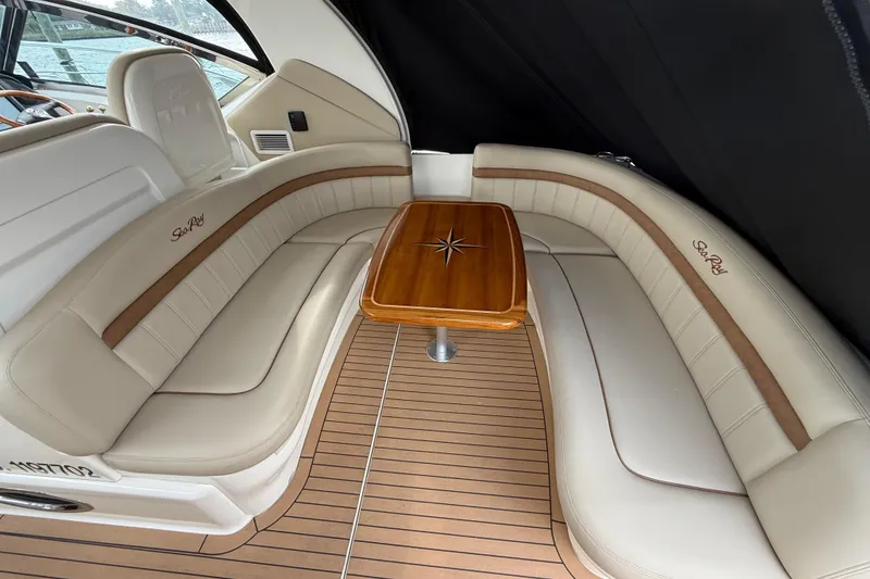 Slide: The Image of Luxurious 2007 Sea Ray 40 Sundancer interior with elegant seating and wooden table. - 4