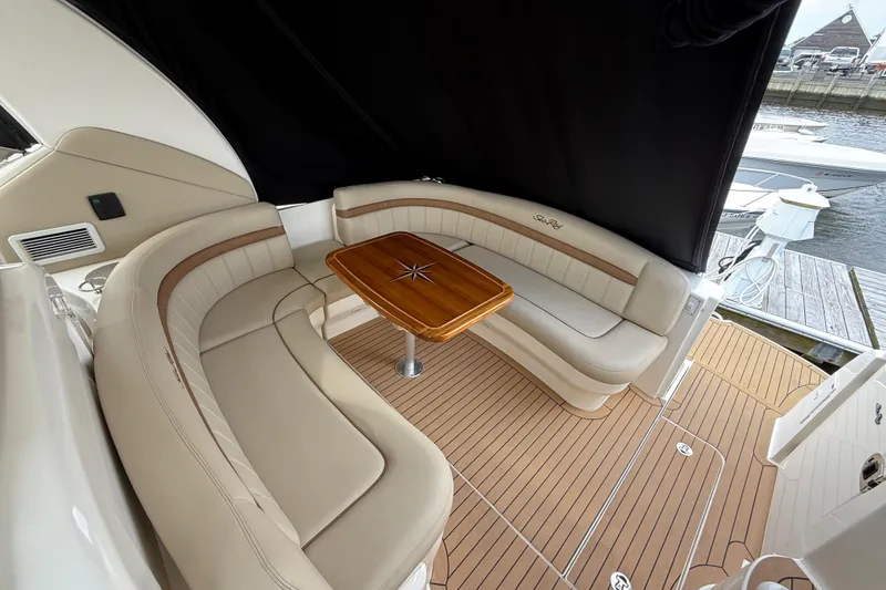 Slide: The Image of Luxurious 2007 Sea Ray 40 Sundancer yacht interior with elegant seating and wooden table. - 5
