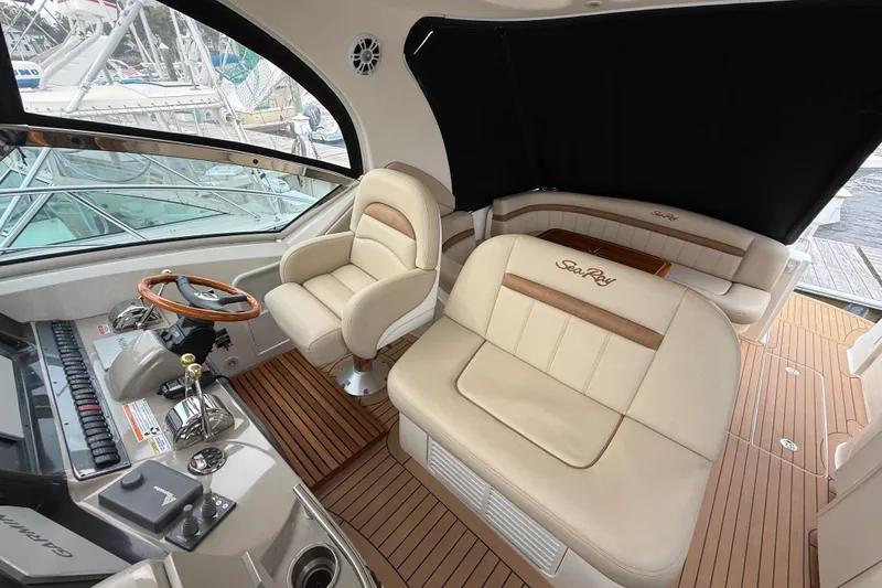 Slide: The Image of 2007 Sea Ray 40 Sundancer interior with leather seating and wooden accents. - 9