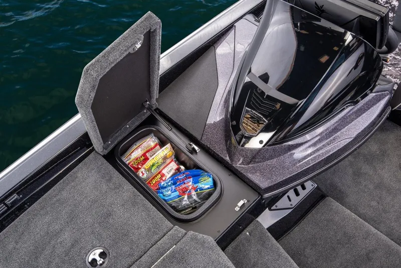 Slide: The Image of Manufacturer Provided Image: 2019 Skeeter ZX 250 boat with open storage compartment containing fishing lures. - 14