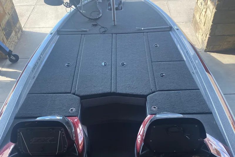 Slide: The Image of 2019 Skeeter ZX250 boat interior with spacious deck and storage compartments. - 4