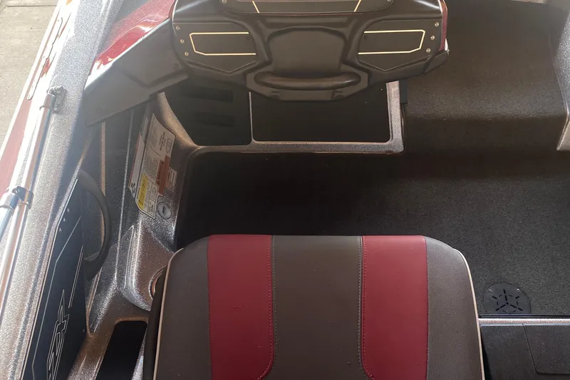 Slide: The Image of 2019 Skeeter ZX250 boat interior with steering wheel and seat detail. - 7