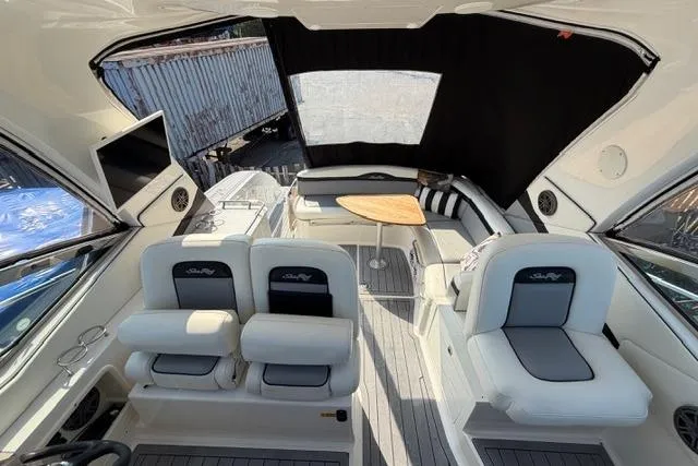 Slide: The Image of Interior view of a 2008 Sea Ray Sundancer 350 yacht with seating and a table. - 17