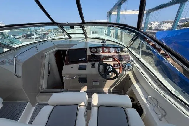 Slide: The Image of Cockpit view of 2008 Sea Ray Sundancer 350 with modern controls and seating. - 11