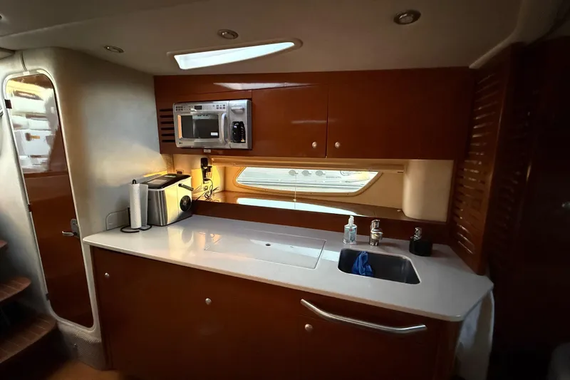 Slide: The Image of Luxurious 2008 Sea Ray 350 Sundancer yacht kitchen with modern amenities and sleek design. - 10