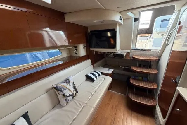 Slide: The Image of Interior of 2008 Sea Ray Sundancer 350 yacht with elegant seating and modern amenities. - 31