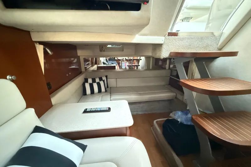 Slide: The Image of Interior of 2008 Sea Ray 350 Sundancer yacht with cozy seating and wooden steps. - 12