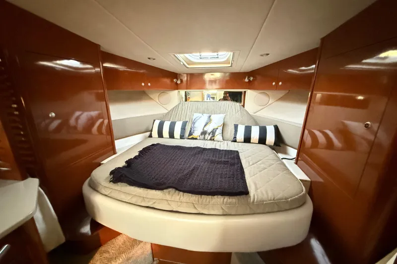 Slide: The Image of Luxurious cabin interior of 2008 Sea Ray 350 Sundancer yacht with cozy bedding. - 8