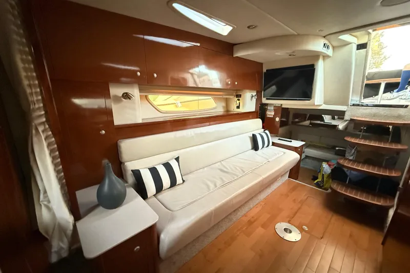 Slide: The Image of Luxurious interior of 2008 Sea Ray 350 Sundancer yacht with sofa and TV. - 9