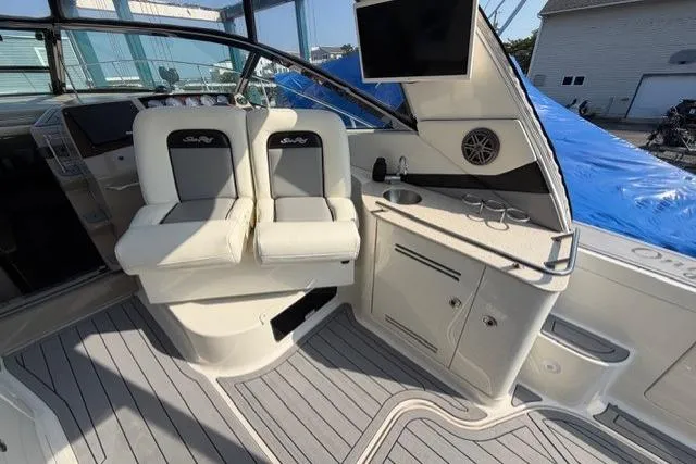 Slide: The Image of Interior of 2008 Sea Ray Sundancer 350 yacht with helm seats and kitchenette. - 9