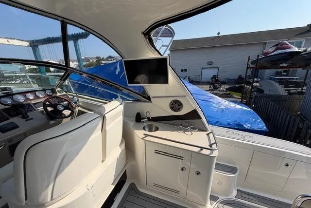 Slide: The Image of Interior view of a 2008 Sea Ray Sundancer 350 yacht cockpit with steering wheel and sink. - 10