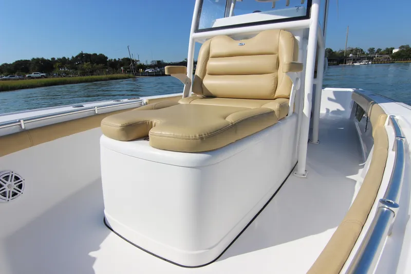 Slide: The Image of 2021 Sportsman Masters 267OE Bay Boat with tan seating, docked on a sunny day. - 10