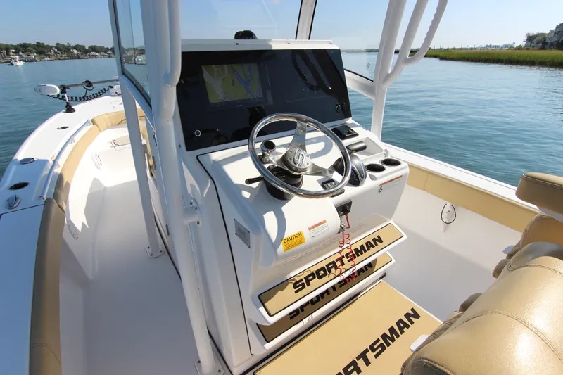 Slide: The Image of 2021 Sportsman Masters 267OE Bay Boat interior with steering console and navigation display. - 16