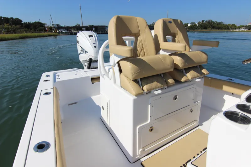 Slide: The Image of 2021 Sportsman Masters 267OE Bay Boat with dual seats and Yamaha V8 engine on water. - 22
