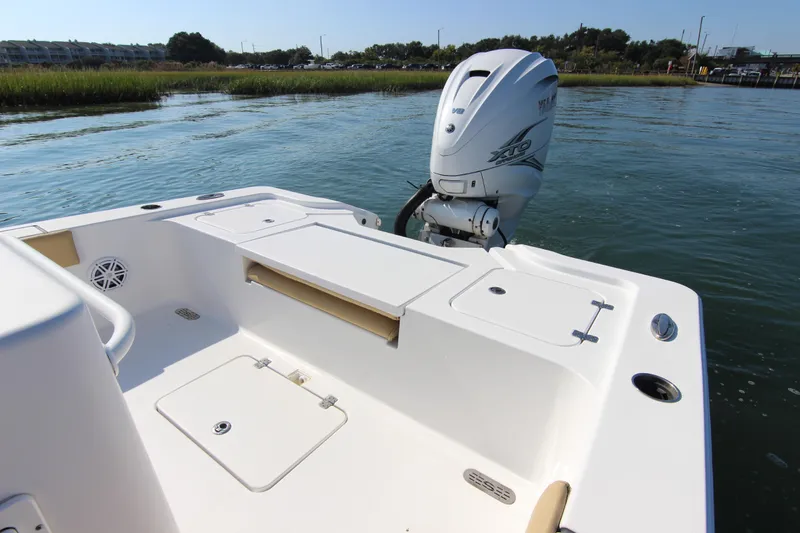 Slide: The Image of 2021 Sportsman Masters 267OE Bay Boat with Yamaha XTO engine on calm water. - 23