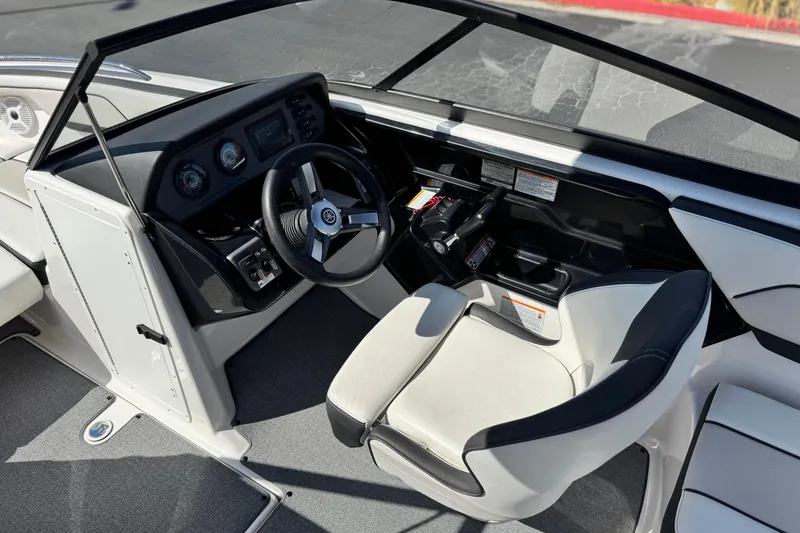 Slide: The Image of 2019 Yamaha Boats AR210 cockpit with steering wheel and controls, featuring modern design. - 25