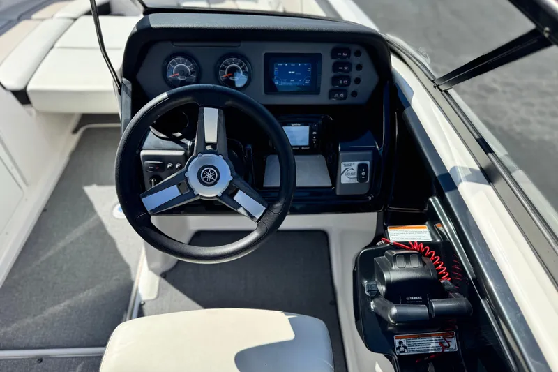 Slide: The Image of 2019 Yamaha Boats AR210 dashboard with steering wheel and control panel. - 26