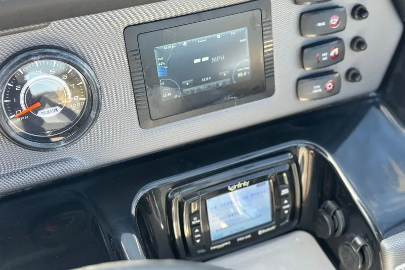 Slide: The Image of Dashboard of 2019 Yamaha Boats AR210 with speedometer and control panel. - 27