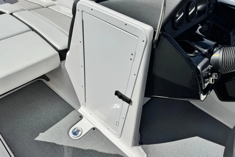 Slide: The Image of 2019 Yamaha Boats AR210 interior showing seating and dashboard details. - 29