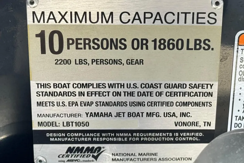 Slide: The Image of 2019 Yamaha Boats AR210 capacity plate, 10 persons or 1860 lbs, safety compliance details. - 32