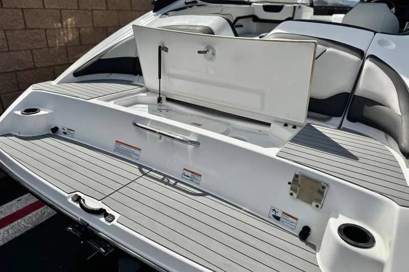 Slide: The Image of 2019 Yamaha Boats AR210 swim platform with storage compartment open. - 7