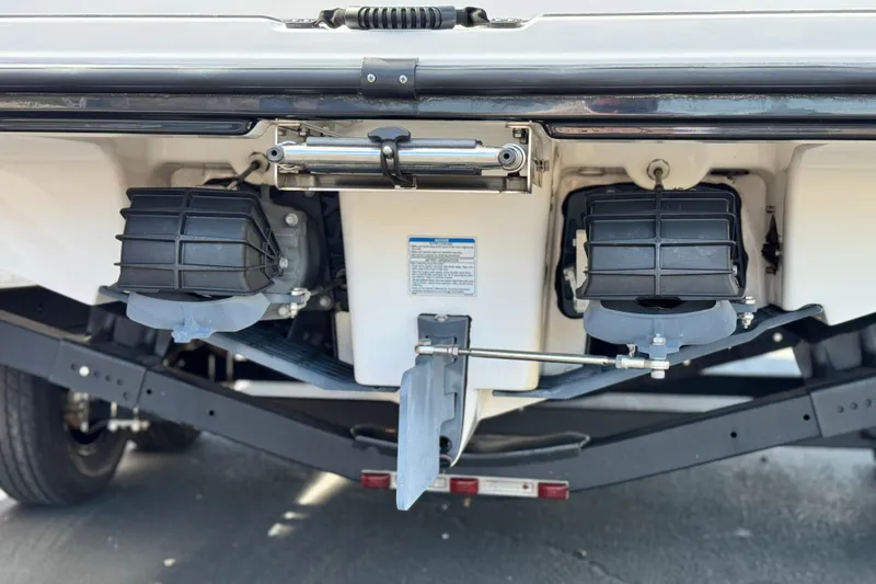 Slide: The Image of 2019 Yamaha Boats AR210 jet propulsion system, rear view, showcasing dual engines and trailer. - 8