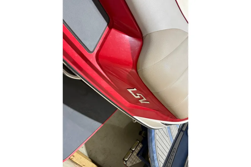 Slide: The Image of Red and beige interior of 2009 Malibu Wakesetter 23 LSV boat. - 23