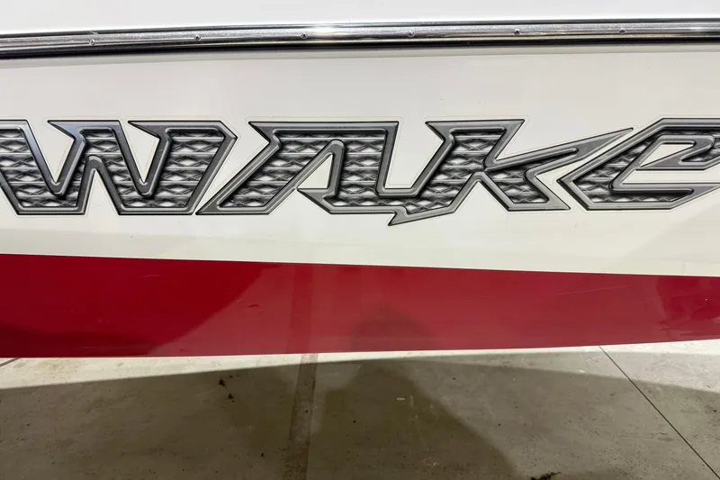 Slide: The Image of Close-up of 2009 Malibu Wakesetter 23 LSV boat logo on red and white hull. - 32
