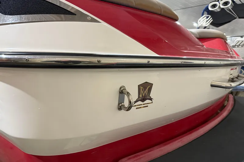 Slide: The Image of 2009 Malibu Wakesetter 23 LSV boat, red and white exterior, close-up view. - 38