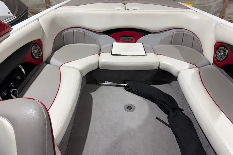 Slide: The Image of Interior of a 2009 Malibu Wakesetter 23 LSV boat with white and gray seating. - 6