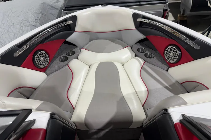 Slide: The Image of 2009 Malibu Wakesetter 23 LSV boat interior with red, gray, and white seating. - 7
