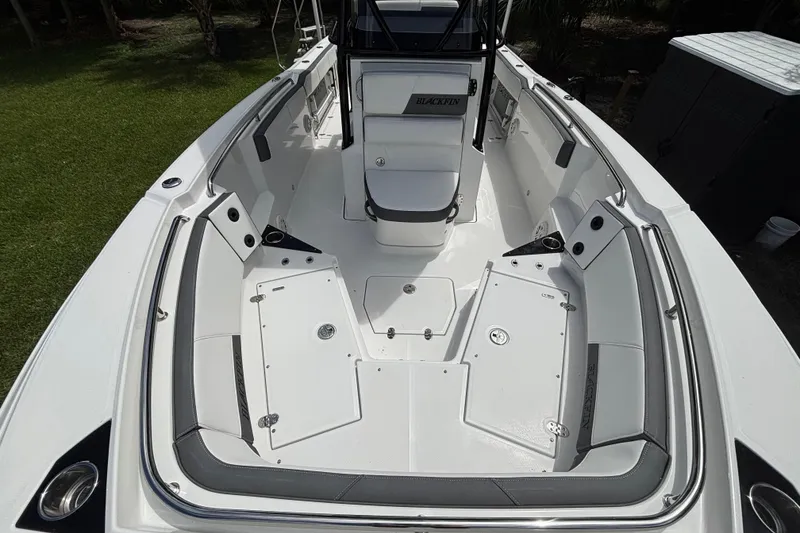 Slide: The Image of 2020 Blackfin 252 CC boat interior with spacious seating and storage compartments. - 16