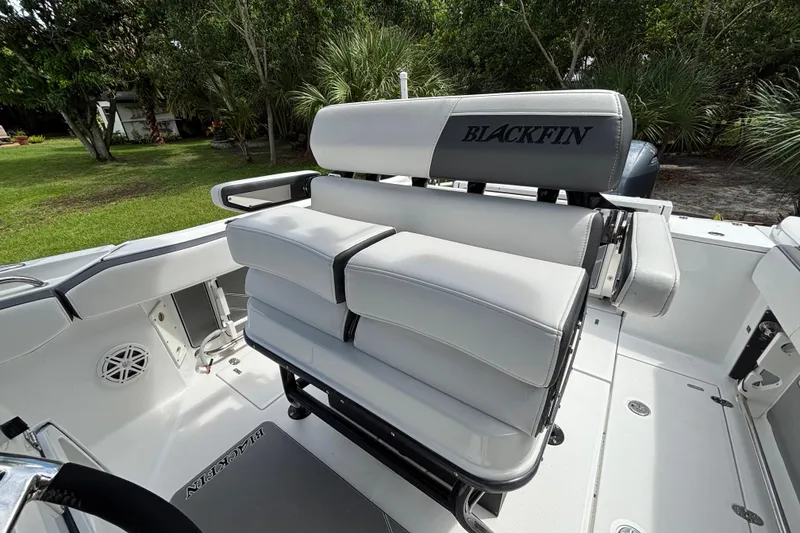 Slide: The Image of 2020 Blackfin 252 CC boat interior with cushioned seating and sleek design. - 21