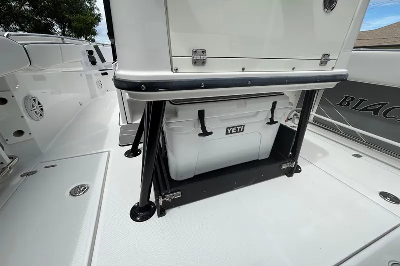 Slide: The Image of 2020 Blackfin 252 CC boat deck with Yeti cooler storage. - 30