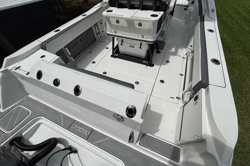Slide: The Image of 2020 Blackfin 252 CC boat interior with seating and storage compartments. - 8
