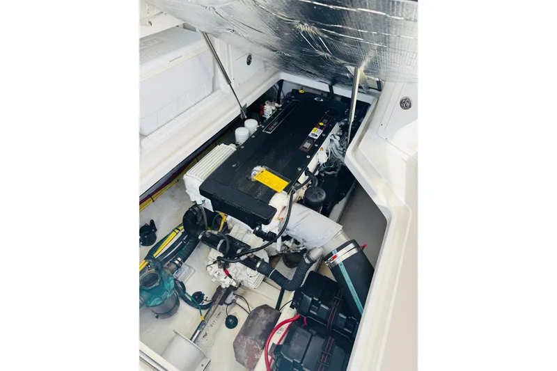 Slide: The Image of Engine compartment of a 2007 Back Cove 29 boat, showcasing mechanical components. - 20