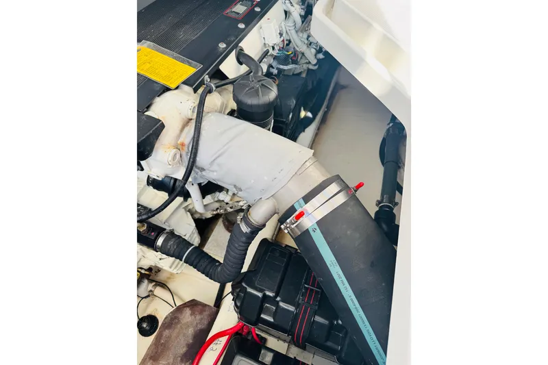 Slide: The Image of Engine compartment of a 2007 Back Cove 29 boat, showcasing mechanical components. - 24