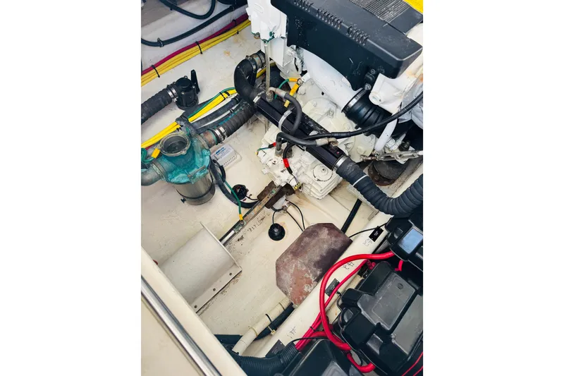 Slide: The Image of Engine compartment of a 2007 Back Cove 29 boat, showcasing mechanical components. - 25