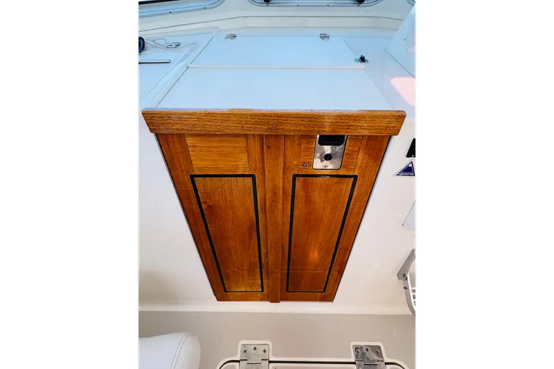 Slide: The Image of Wooden cabinet door on 2007 Back Cove 29 boat interior. - 27