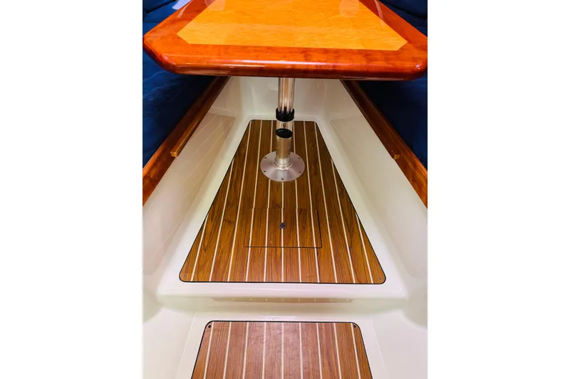 Slide: The Image of 2007 Back Cove 29 interior with wooden flooring and table. - 3