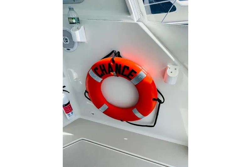 Slide: The Image of Orange life ring labeled "Chance" on 2007 Back Cove 29 boat interior. - 34