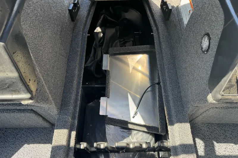 Slide: The Image of Interior view of 2026 Lund 1775 Crossover XS boat storage compartment. - 10