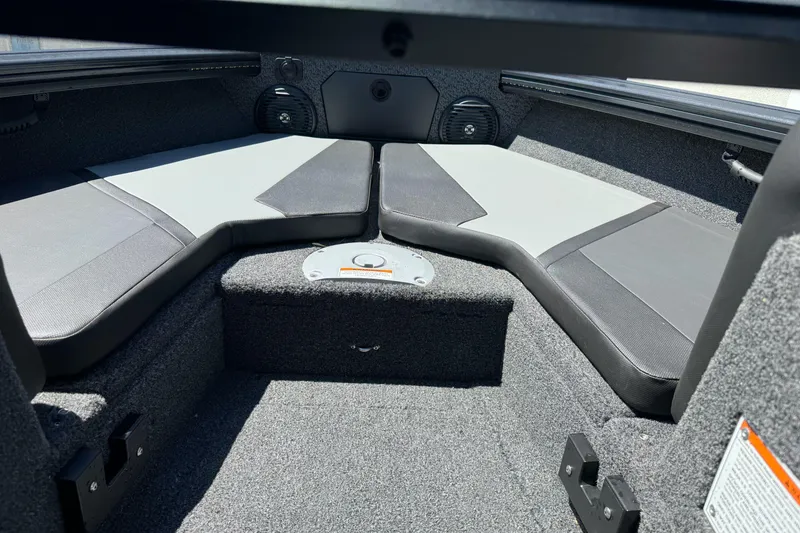 Slide: The Image of Interior of 2026 Lund 1775 Crossover XS boat, featuring cushioned seating and carpeted flooring. - 17