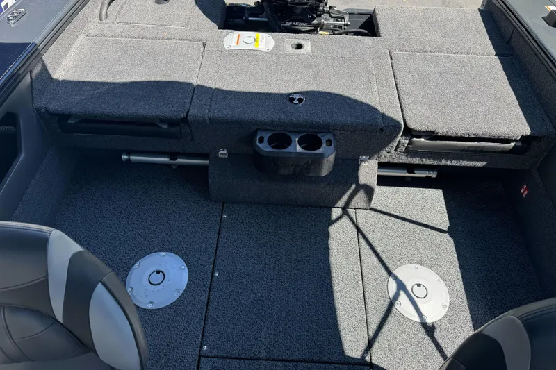 Slide: The Image of Interior of 2026 Lund 1775 Crossover XS boat with carpeted flooring and seating. - 13