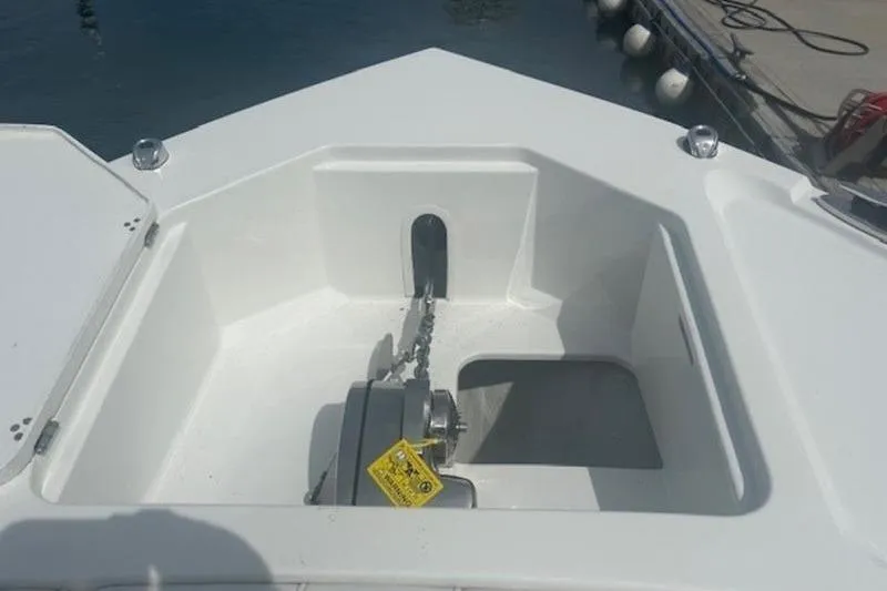 Slide: The Image of 2025 Parker 2900 Center Console anchor compartment with chain and winch. - 11