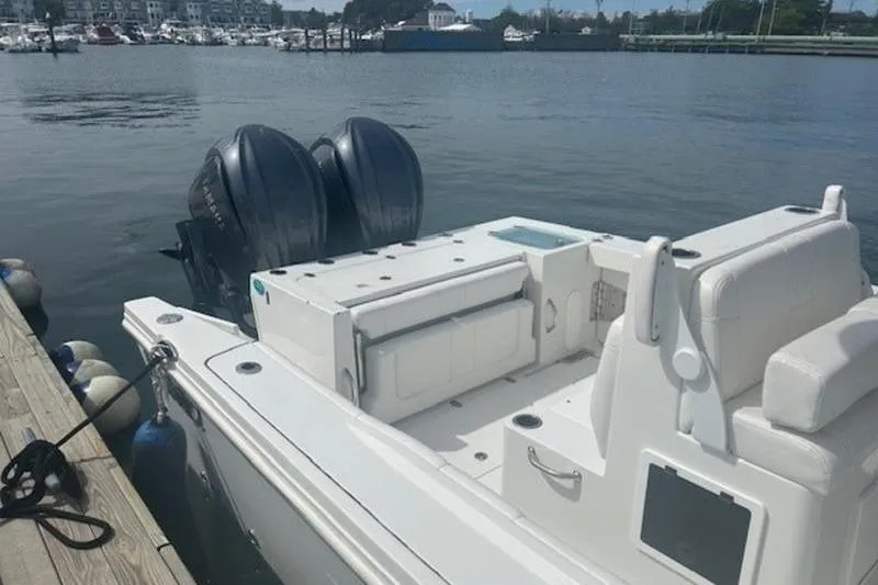 Slide: The Image of 2025 Parker 2900 Center Console boat docked with dual outboard engines. - 17